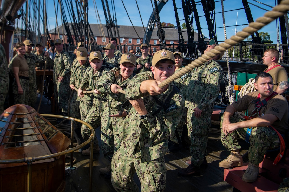 Petty officers first class, selected for promotion to chief petty officer, line handle aboard USS Constitution during Chief Petty Officer Heritage Weeks.