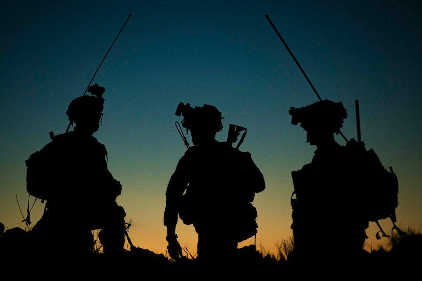 Three soldiers shown in silhouette.