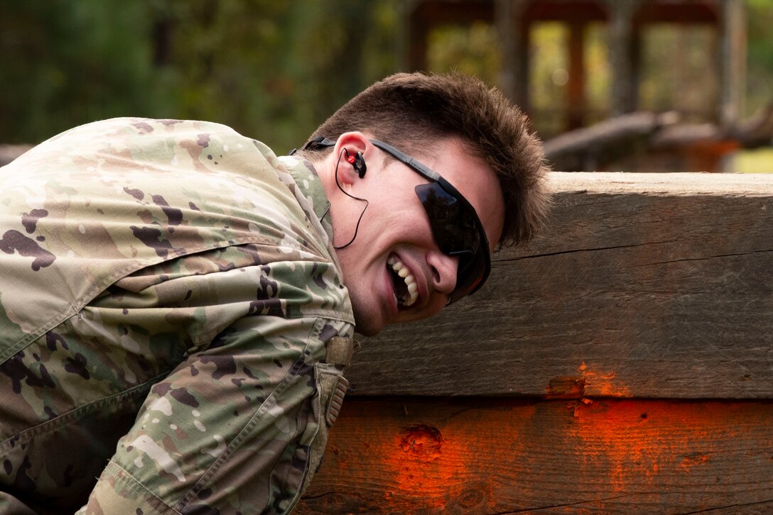 A photo of an Airman ducking for cover.