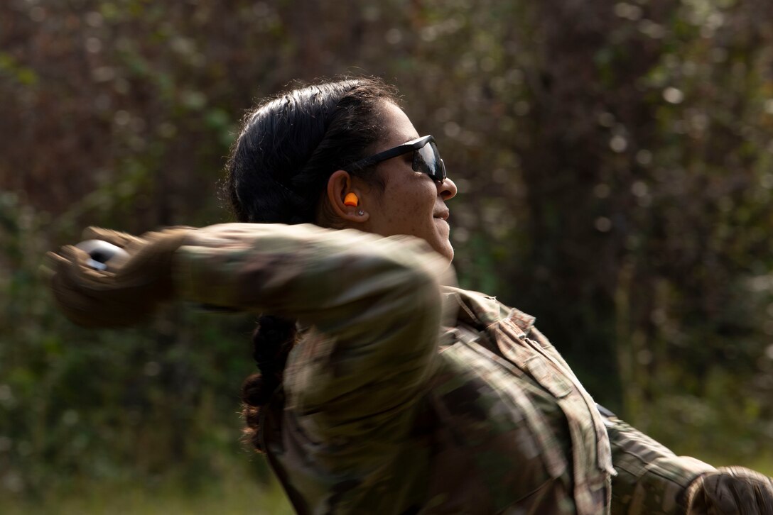 A photo of an Airman throwing a grenade.