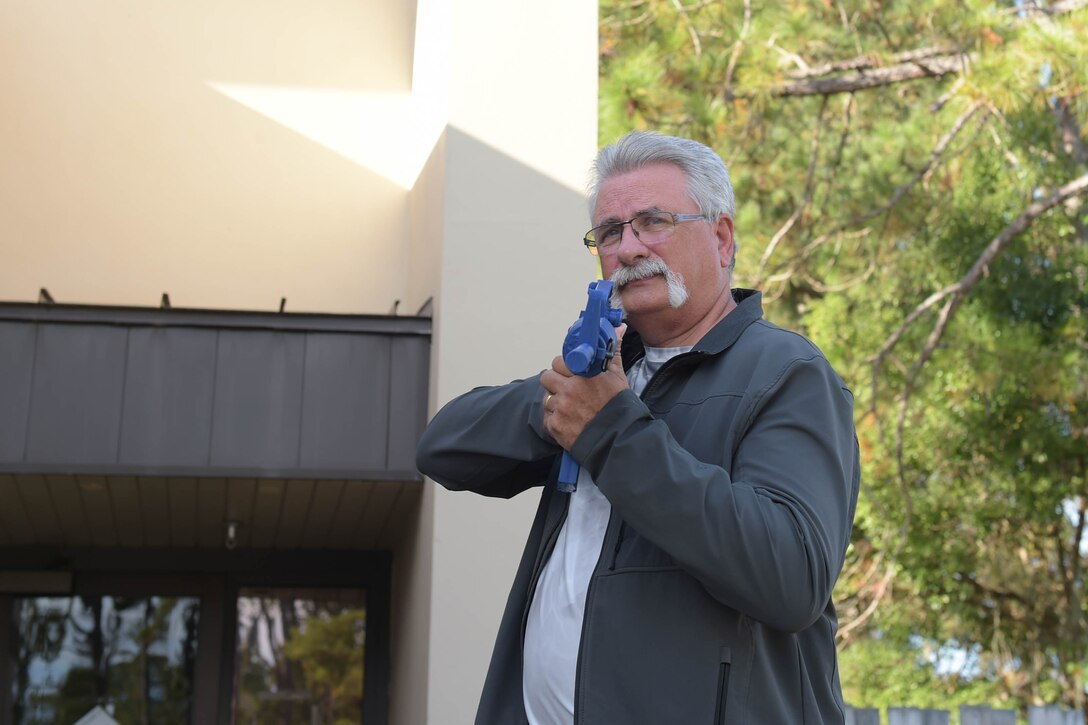 A photo of a man holding weapon.