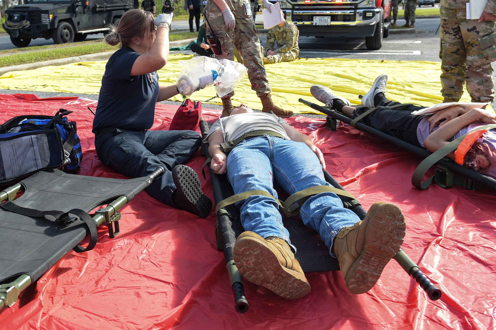 A photo of a woman helping "injured" participants.