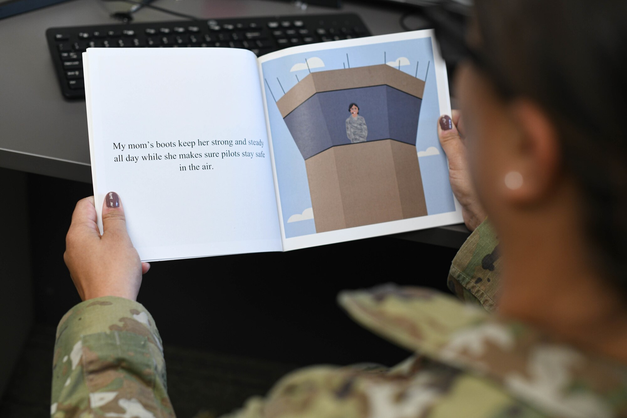 U.S. Air Force 1st Lt. Elizabeth Gordon, 325th Operations Support Squadron airfield management officer, reads a children’s book she wrote at Tyndall Air Force Base, Florida, Oct. 18, 2021.