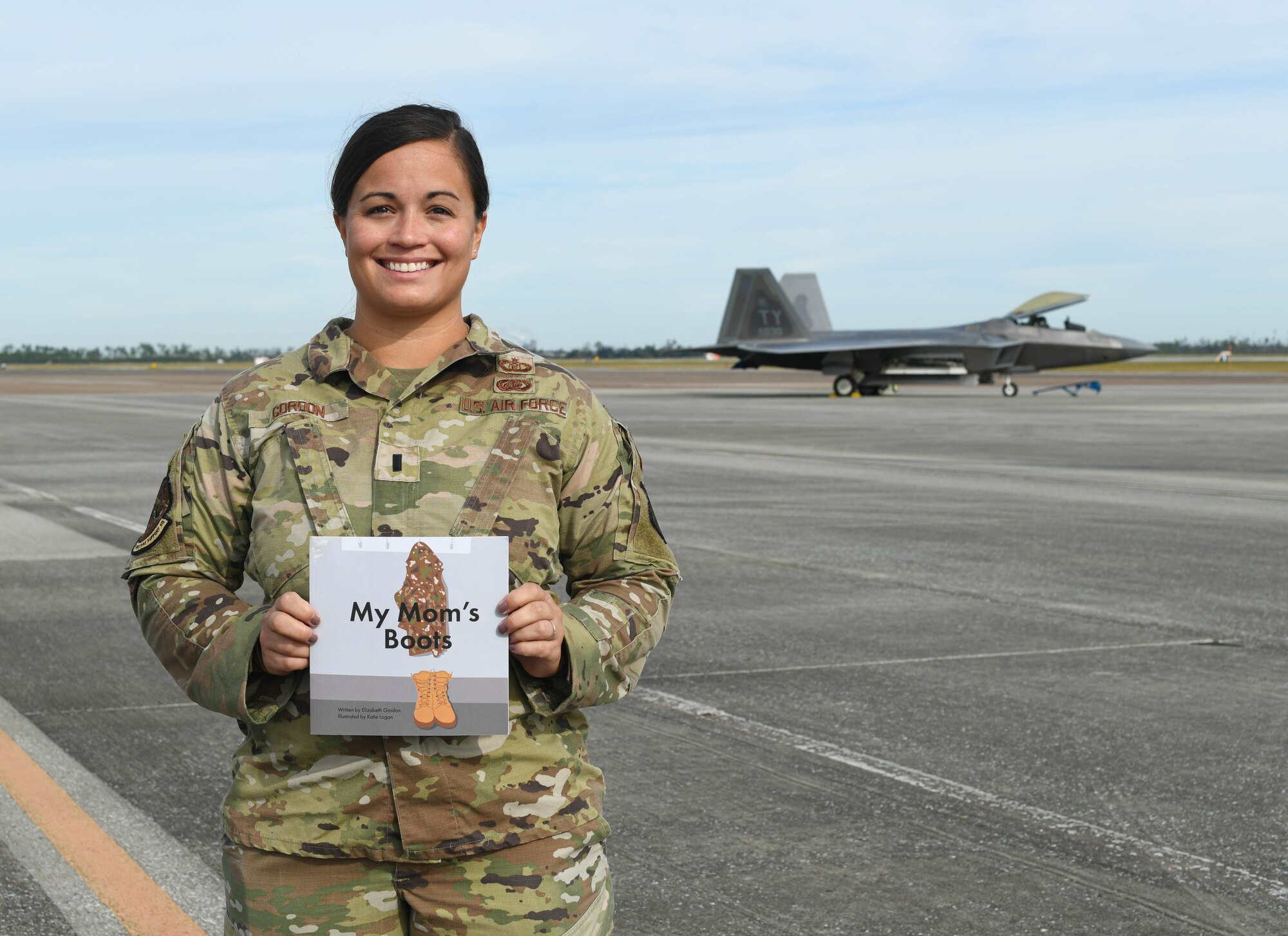 U.S. Air Force 1st Lt. Elizabeth Gordon, 325th Operations Support Squadron airfield management officer, holds a children’s book she wrote at Tyndall Air Force Base, Florida, Oct. 18, 2021.