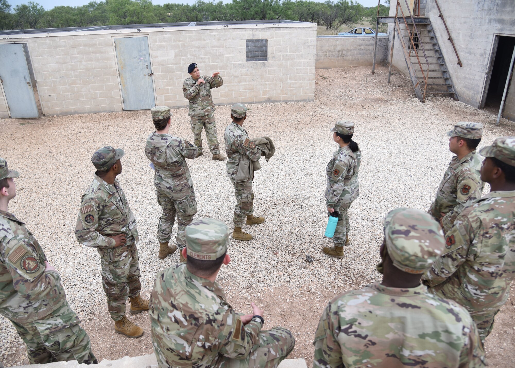 U.S. Air Force Tech. Sgt. Julian Rangel, 17th Security Forces Squadron non-commissioned officer in charge of training, briefs Goodfellow members during an Expeditionary Readiness Training on Goodfellow Air Force Base.