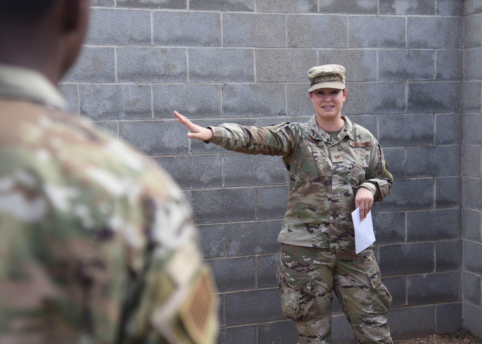 U.S. Air Force Tech. Sgt. Breanna Boykin, 316th Training Squadron Instructor, briefs Goodfellow members in a base defense course during an Expeditionary Readiness Training on Goodfellow Air Force Base.