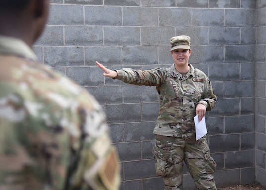 U.S. Air Force Tech. Sgt. Breanna Boykin, 316th Training Squadron Instructor, briefs Goodfellow members in a base defense course during an Expeditionary Readiness Training on Goodfellow Air Force Base.