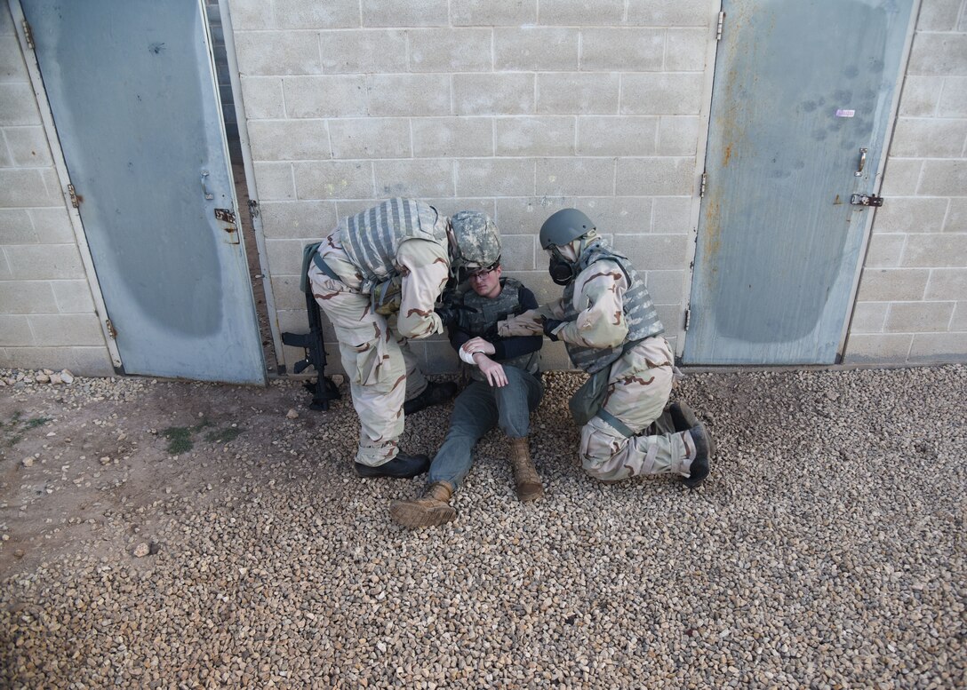 Goodfellow members conduct self-aid buddy care during an Expeditionary Readiness Training on Goodfellow Air Force Base.