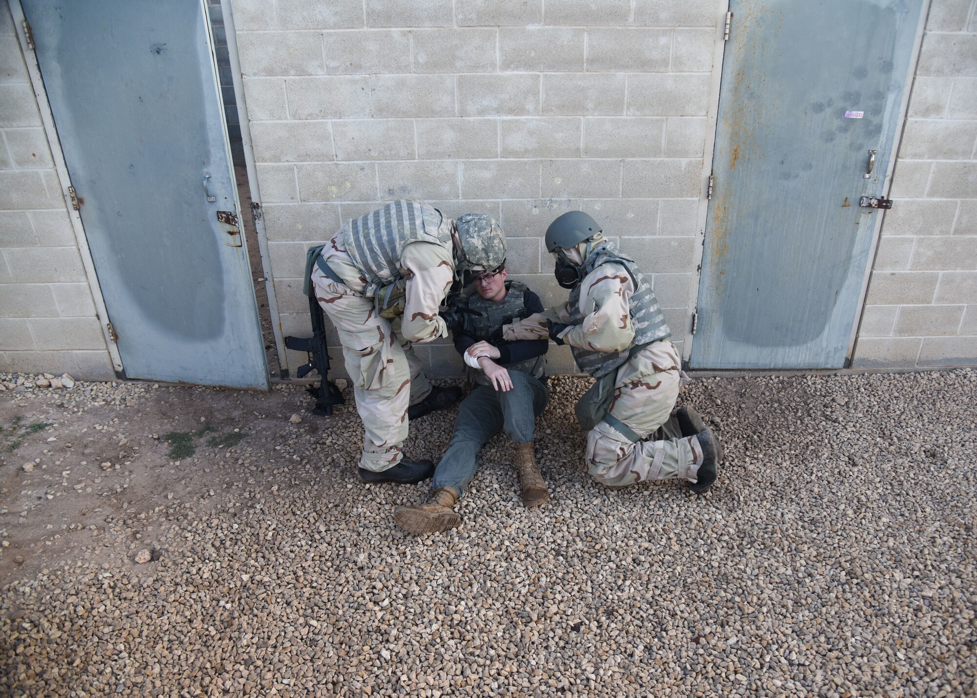 Goodfellow members conduct self-aid buddy care during an Expeditionary Readiness Training on Goodfellow Air Force Base.