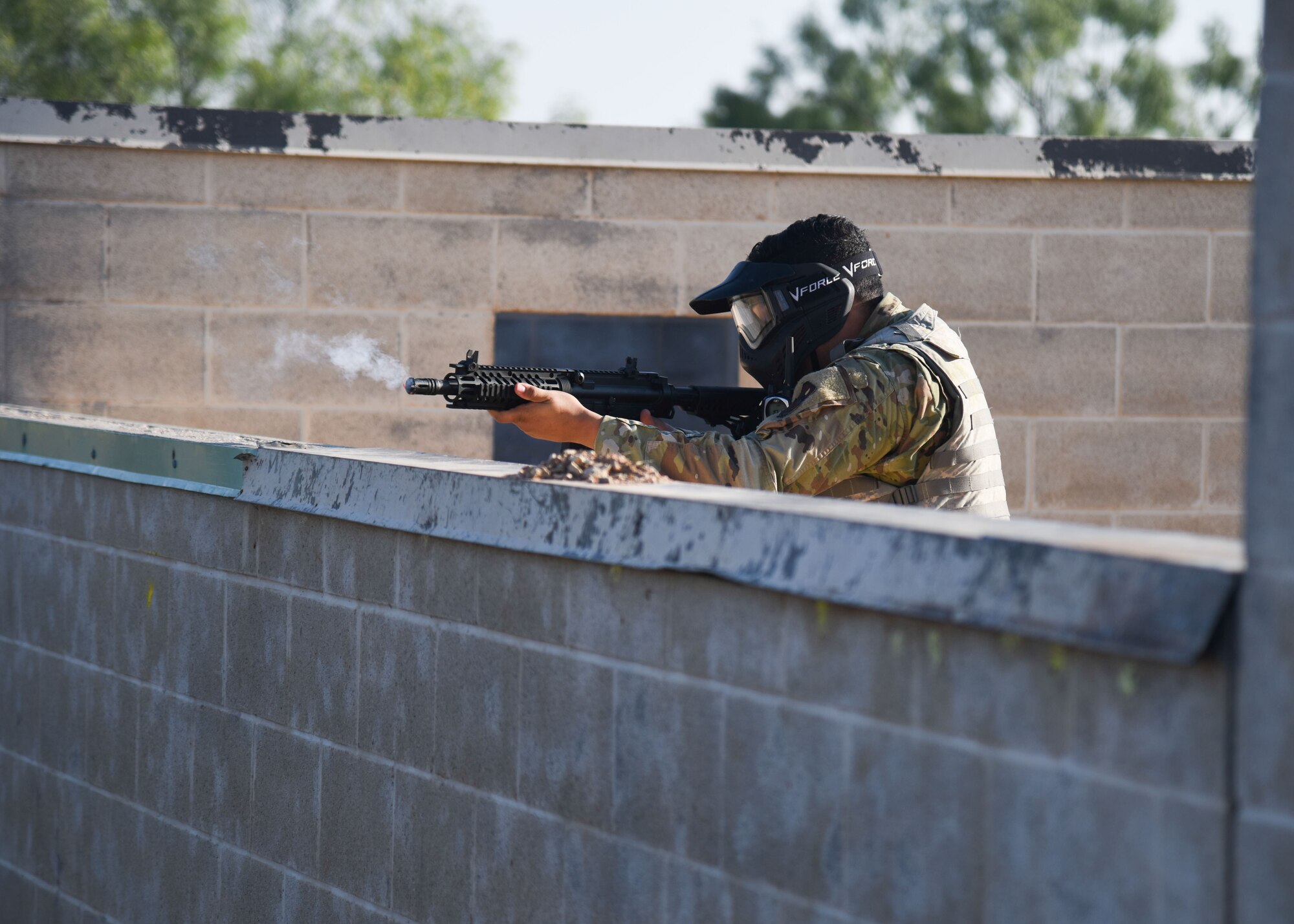 A Goodfellow member shoots a paintball gun during an Expeditionary Readiness Training on Goodfellow Air Force Base.