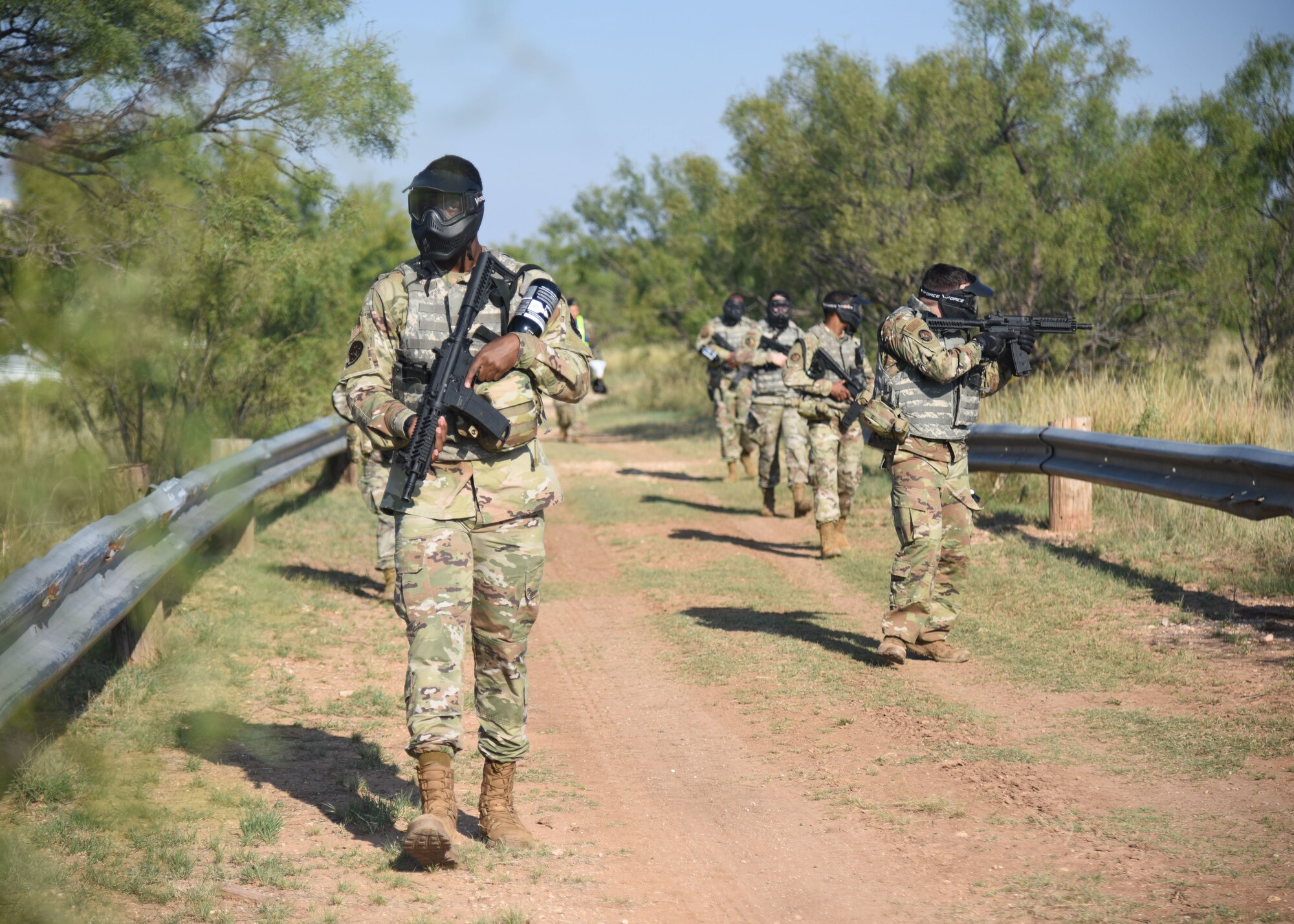 Goodfellow members conduct a patrol during an Expeditionary Readiness Training on Goodfellow Air Force Base.