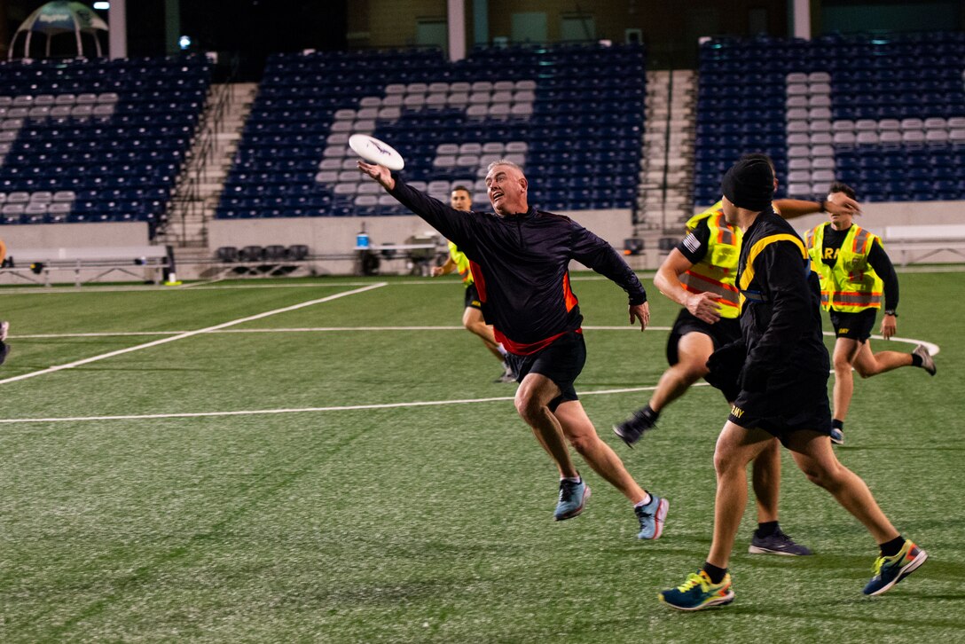 Col. Michael Helton, U.S. Army Corps of Engineers Portland Distract Commander, catches a frisbee at the Michael G. Morrison, S.J., Stadium at Creighton University, Omaha, Neb., Oct. 21, 2021. As part of the Regional Governance Meeting, USACE members played ultimate frisbee with the Army ROTC cadets from Creighton University.