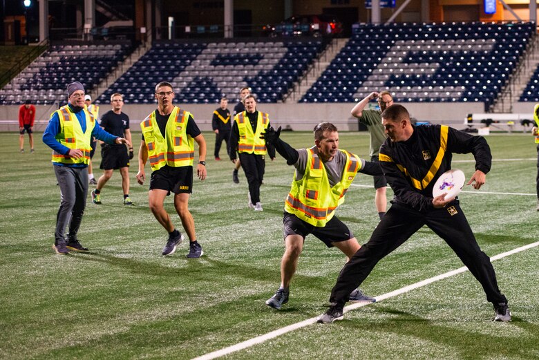 Col. Scott Snyder, U.S. Army Corps of Engineers Omaha Distract Deputy Commander, prepares to throw a frisbee at the Michael G. Morrison, S.J., Stadium at Creighton University, Omaha, Neb., Oct. 21, 2021. As part of the Regional Governance Meeting, USACE members played ultimate frisbee with the Army ROTC cadets from Creighton University.