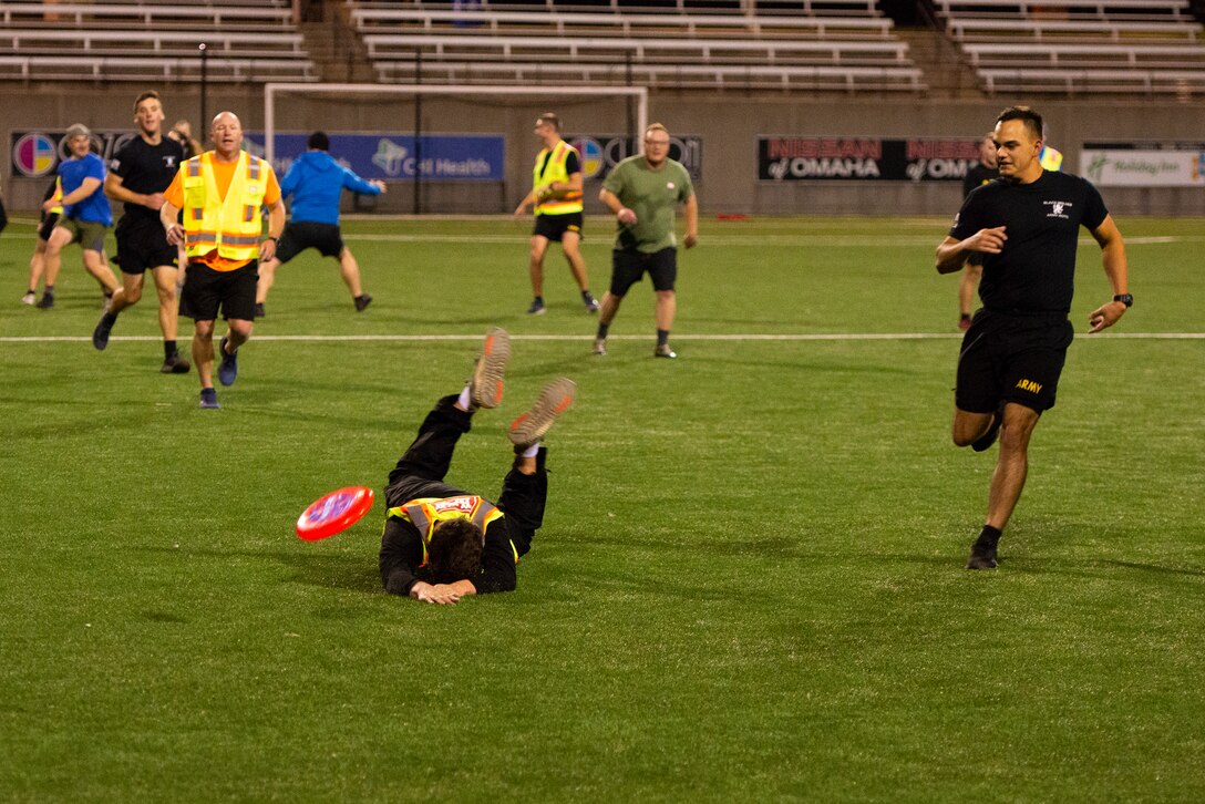 A cadet from the Creighton University Army ROTC learns the hard way that even if you try your hardest, you can still fall flat on your face. As part of the Regional Governance Meeting, the Army ROTC cadets played ultimate frisbee with USACE members in the Michael G. Morrison, S.J., Stadium at Creighton University, Omaha, Neb., Oct. 21, 2021.