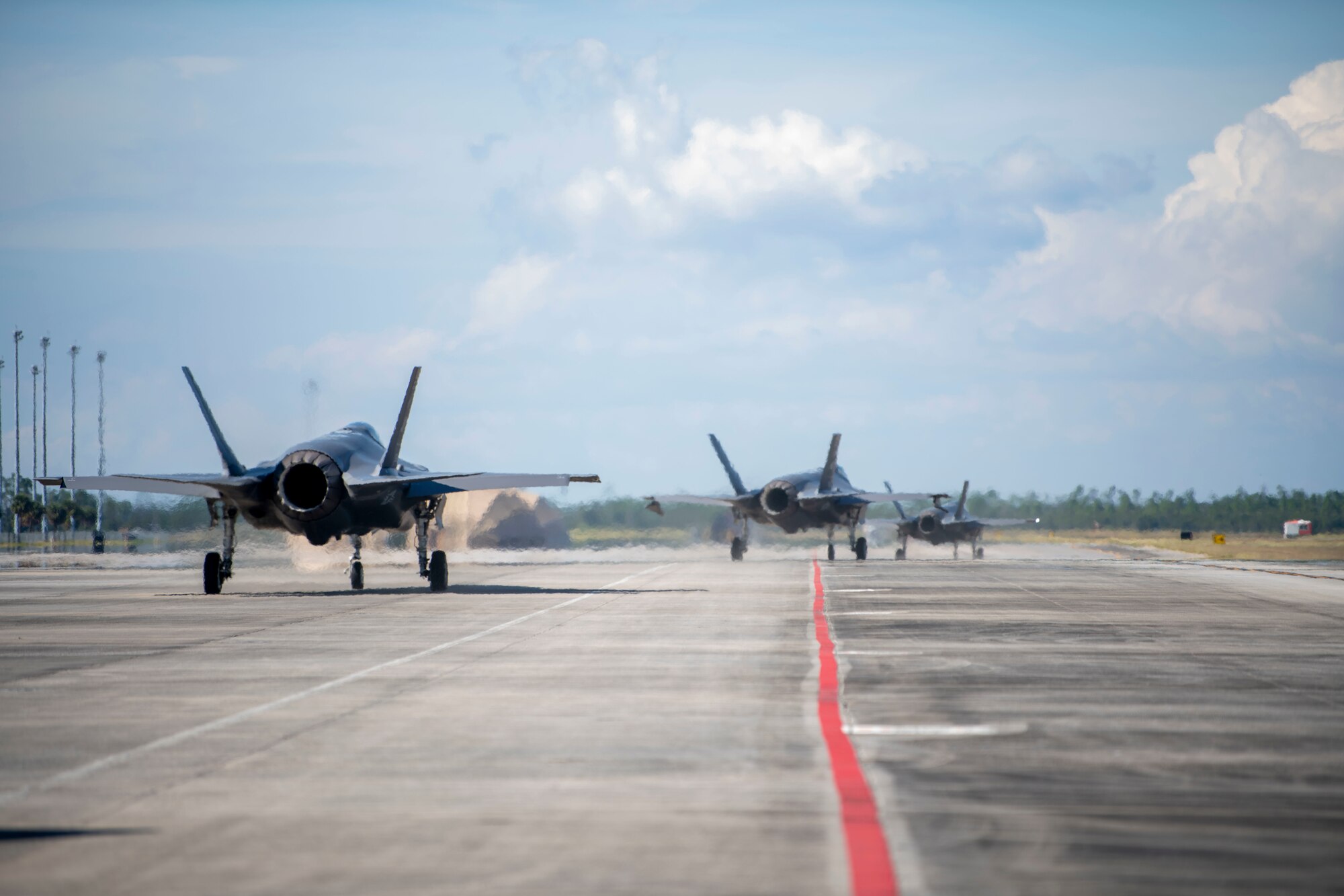 Multiple U.S. Air Force F-35 Lightning II aircraft, assigned to the 354th Fighter Wing, Eielson Air Force Base, Alaska, taxi in preparation for takeoff at Tyndall AFB, Florida, Oct. 15, 2021. The 356th Fighter Squadron participated in the 53rd Weapons Evaluation Group’s Weapons System Evaluation Program, which is an exercise held regularly to evaluate units on combat capabilities during air-to-air operations. (U.S. Air Force photo by Airman 1st Class Tiffany Price)