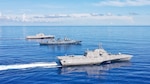 211018-N-PL200-1001 PHILIPPINE SEA (Oct. 18, 2021) Independence-variant littoral combat ships USS Tulsa (LCS 16), left, and USS Jackson (LCS 6), right, sail with German Navy frigate FGS Bayern (F 217), center, in the Philippine Sea. Jackson & Tulsa, part of Destroyer Squadron Seven, are on a rotational deployment in the U.S. 7th Fleet area of operation to enhance interoperability with partners and serve as a ready-response force in support of a free and open Indo-Pacific region. (German Navy courtesy photo)
