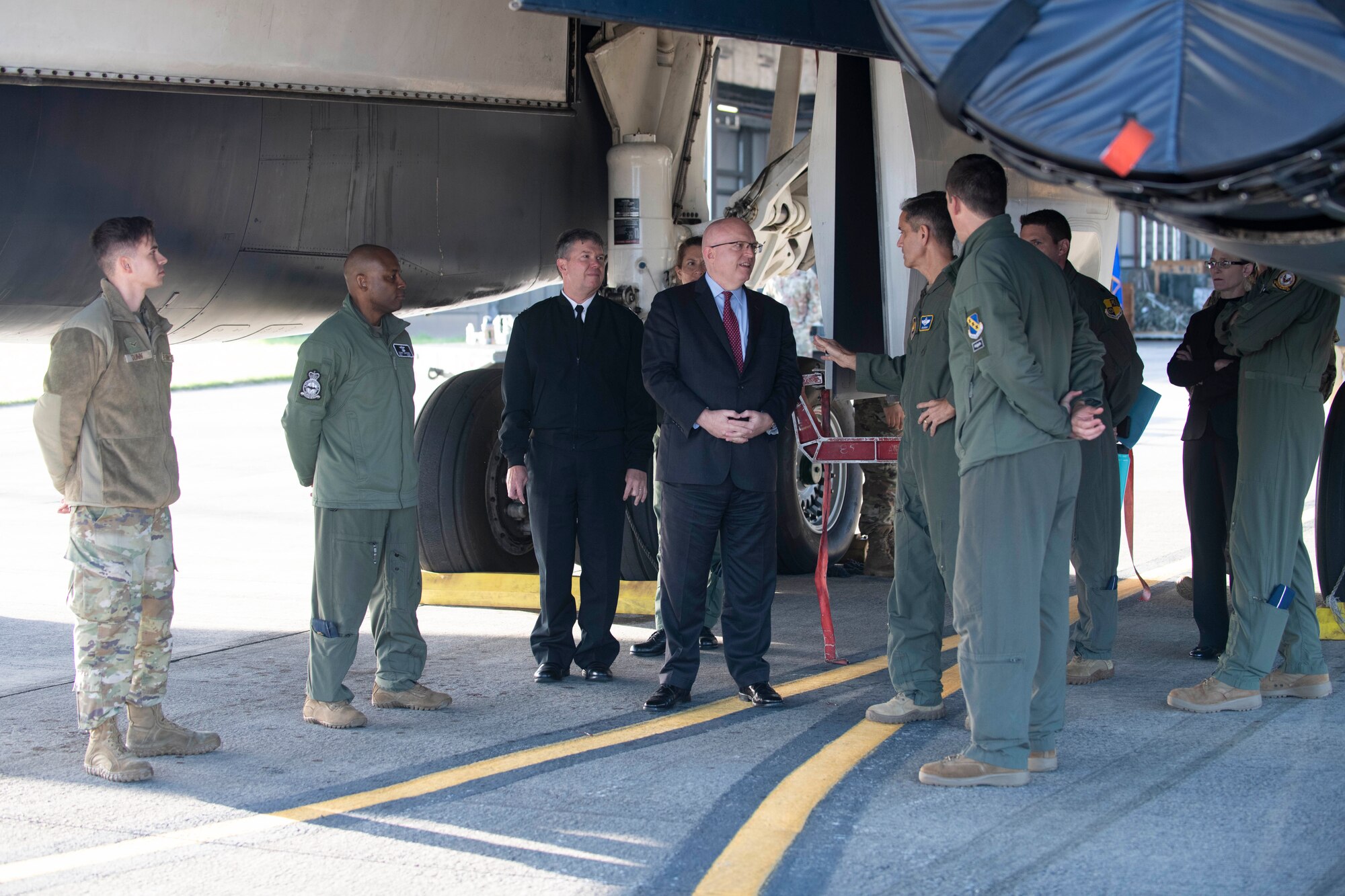 U.S. Air Force Lt. Gen. Steven Basham, center right, U.S. Air Forces in Europe-Air Forces Africa deputy commander, speaks with Ambassador Philip T. Reeker, center, U.S. Embassy London Chargé d’Affaires, during a visit to Royal Air Force Fairford, England, Oct. 20, 2021. Reeker and Basham visited RAF Fairford to immerse with Airmen from the 9th Expeditionary Bomb Squadron who are temporarily stationed at Fairford for a BTF deployment. A BTF demonstrates the global employment of U.S. bombers, providing strategic military advantage to achieve national and combatant commander objectives. (U.S. Air Force photo by Senior Airman Jennifer Zima)