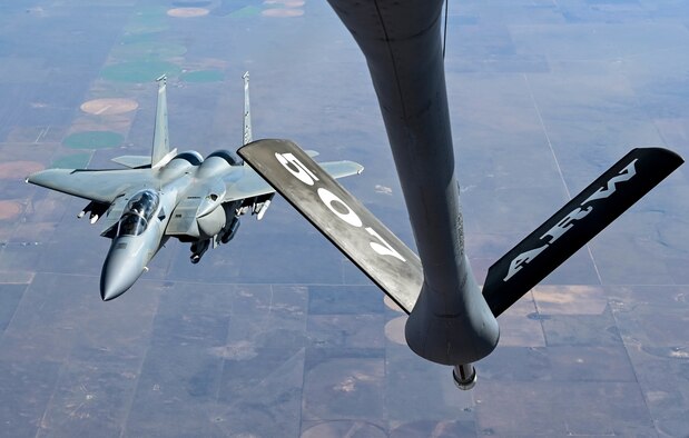 An F-15EX assigned to the 85th Test and Evaluation Squadron, Eglin Air Force Base, Florida, receives fuel from a KC-135 assigned to the 465th Air Refueling Squadron, Tinker AFB, Oklahoma, Oct. 15, 2021. In-air refueling allows fighter aircraft to stay airborne for longer periods of time without having to land to refuel. (U.S. Air Force photo by 2nd Lt. Mary Begy)