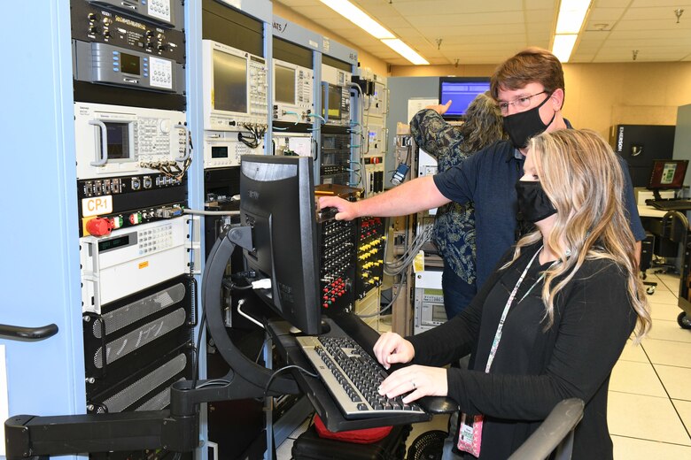 man and women working on a computer