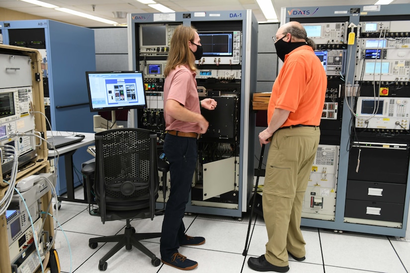 men working on computer console