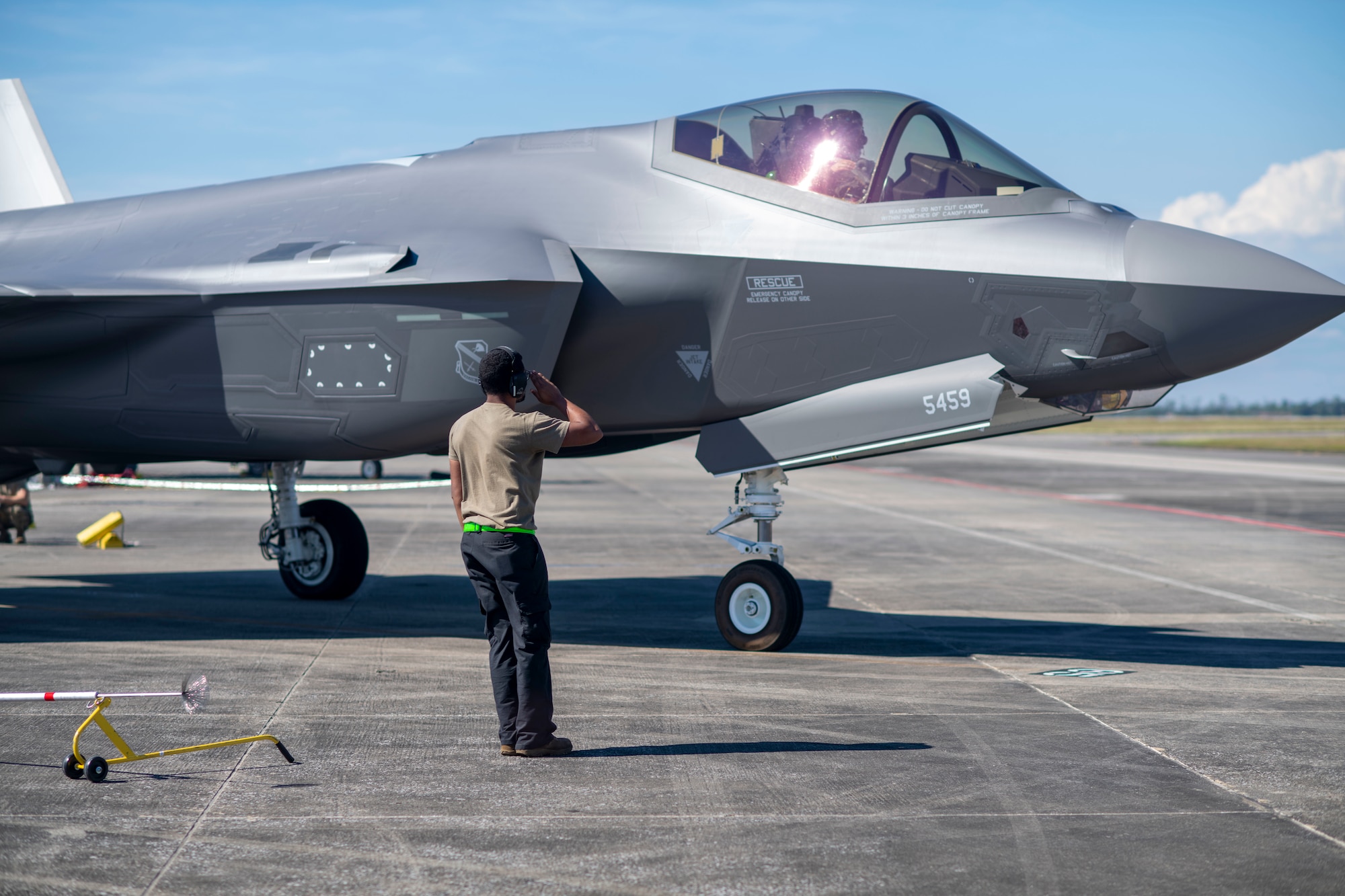 U.S. Air Force Staff Sgt. David Jones, 356th Aircraft Maintenance Unit crew chief, salutes a pilot during a launch at Tyndall AFB, Florida, Oct. 15, 2021. The 356th AMU arrived at Tyndall in support of the 53rd Weapons Evaluation Group’s Weapons System Evaluation Program, an exercise held regularly, where units across the Department of Defense are evaluated on combat capabilities during air-to-air operations. (U.S. Air Force photo by Airman 1st Class Tiffany Price)