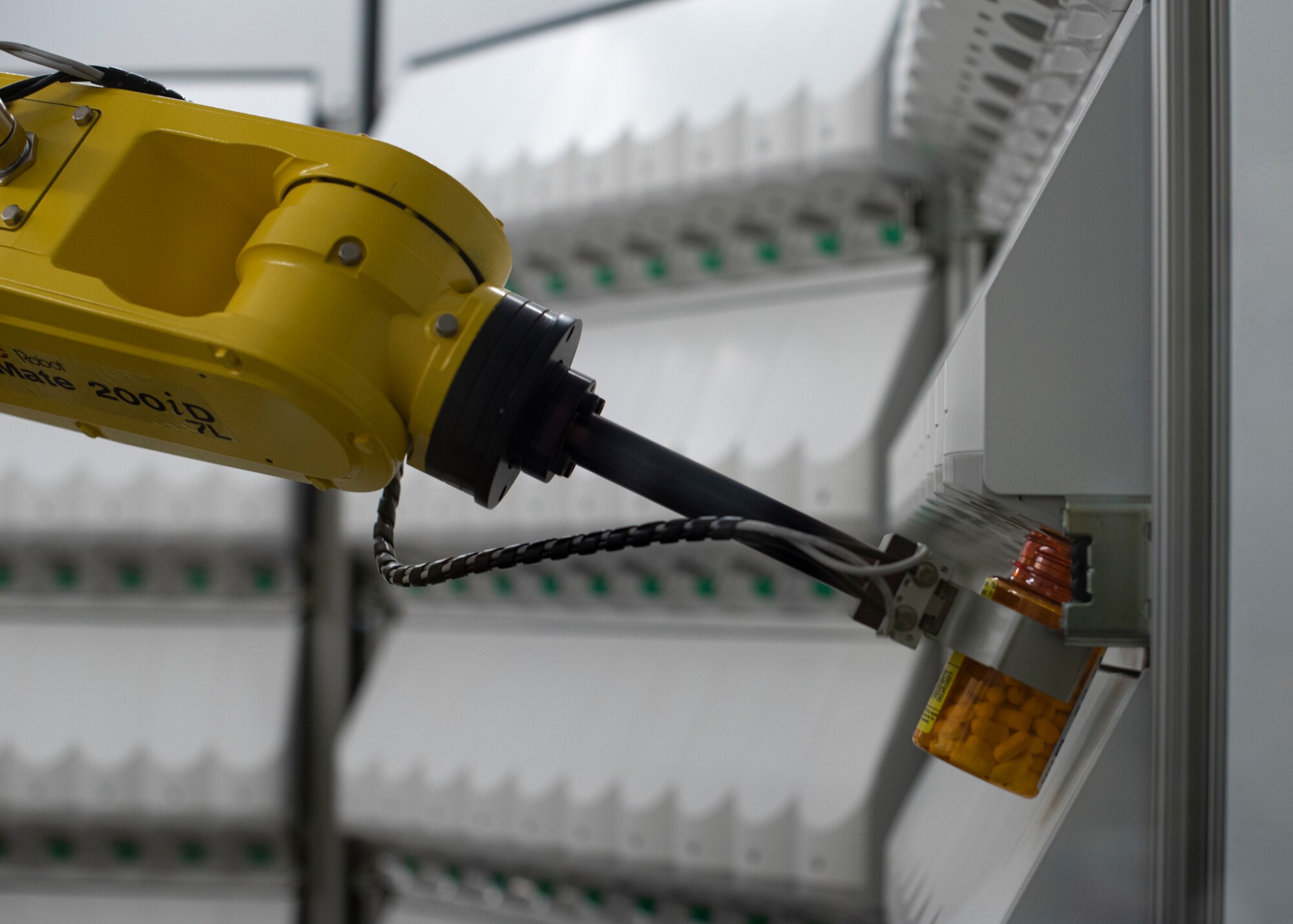 The MacDill Clinic Pharmacy robotic dispensing system collects capsules for a prescription at MacDill Air Force Base, Oct. 20, 2021.