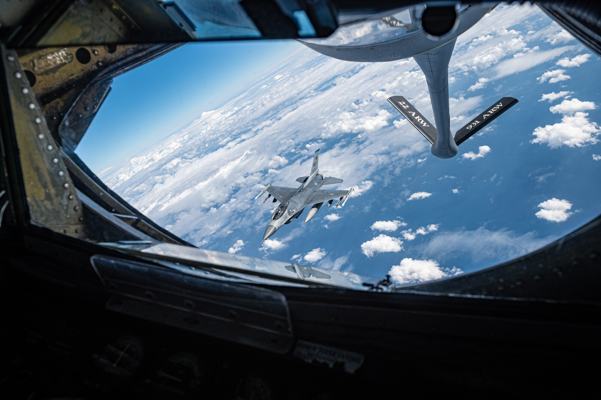 An F-16 Fighting Falcon departs after receiving fuel from a KC-135 Stratotanker