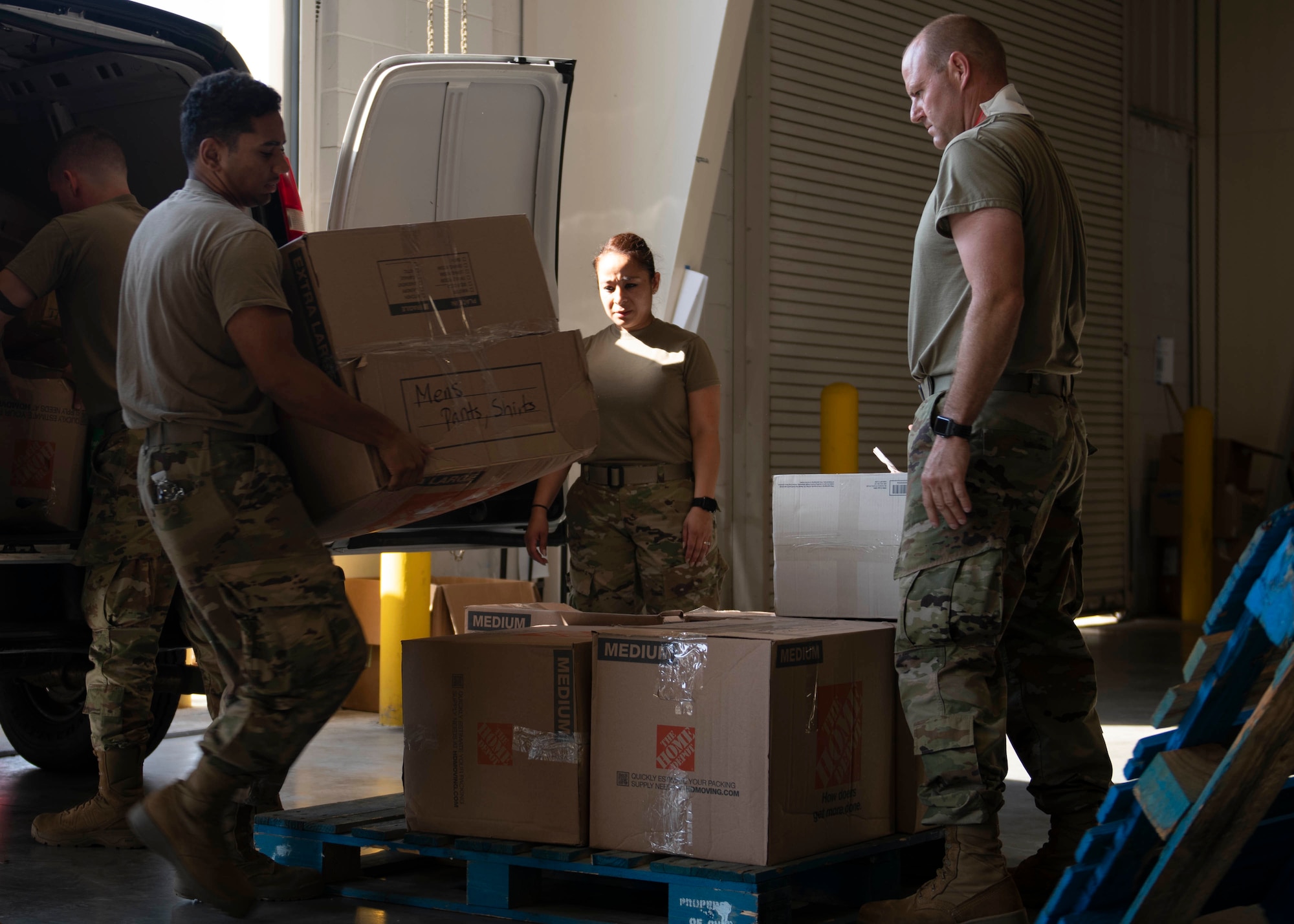 Members of Task Force Liberty unload donated items in Liberty Village, Joint Base McGuire-Dix-Lakehurst, New Jersey, Oct. 16, 2021. The Department of Defense, through U.S. Northern Command, and in support of the Department of Homeland Security, is providing transportation, temporary housing, medical screening, and general support for at least 50,000 Afghan evacuees at suitable facilities, in permanent or temporary structures, as quickly as possible. This initiative provides Afghan personnel essential support at secure locations outside Afghanistan. (U.S. Air Force photo by Tech. Sgt. J.D. Strong II)