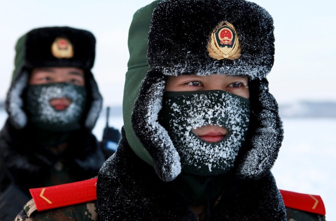 Chinese paramilitary police border guards train in the snow