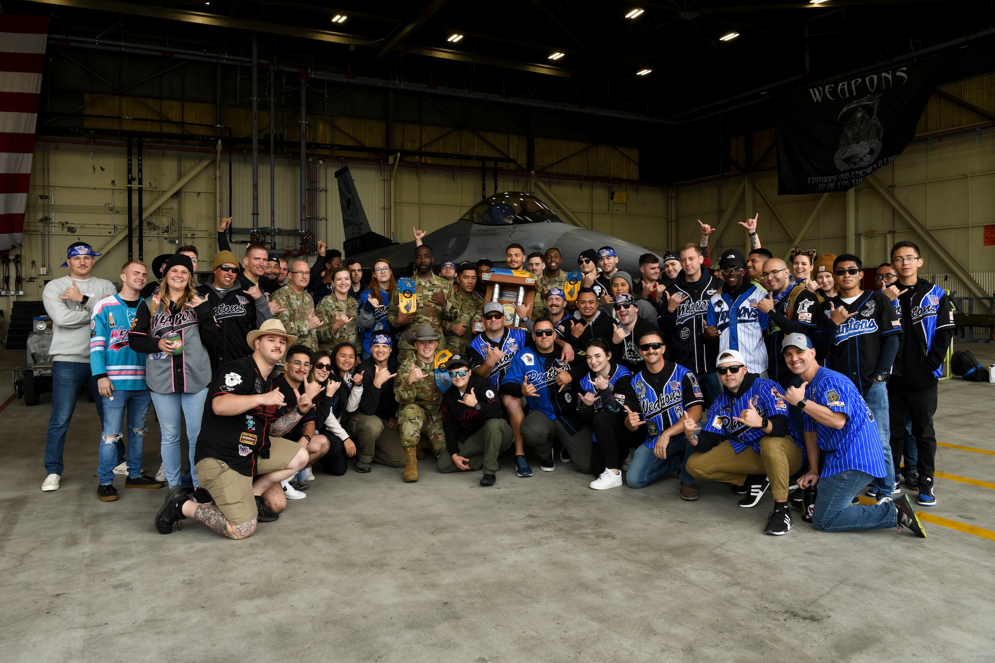 Airmen from the 35th Aircraft Maintenance Unit pose for a photo during the Third Quarter Load Crew Competition at Kunsan Air Base, Republic of Korea, Oct. 16, 2021. Load crew competitions are held for training and to build esprit de corps. (U.S. Air Force photo by Staff Sgt. Jesenia Landaverde)