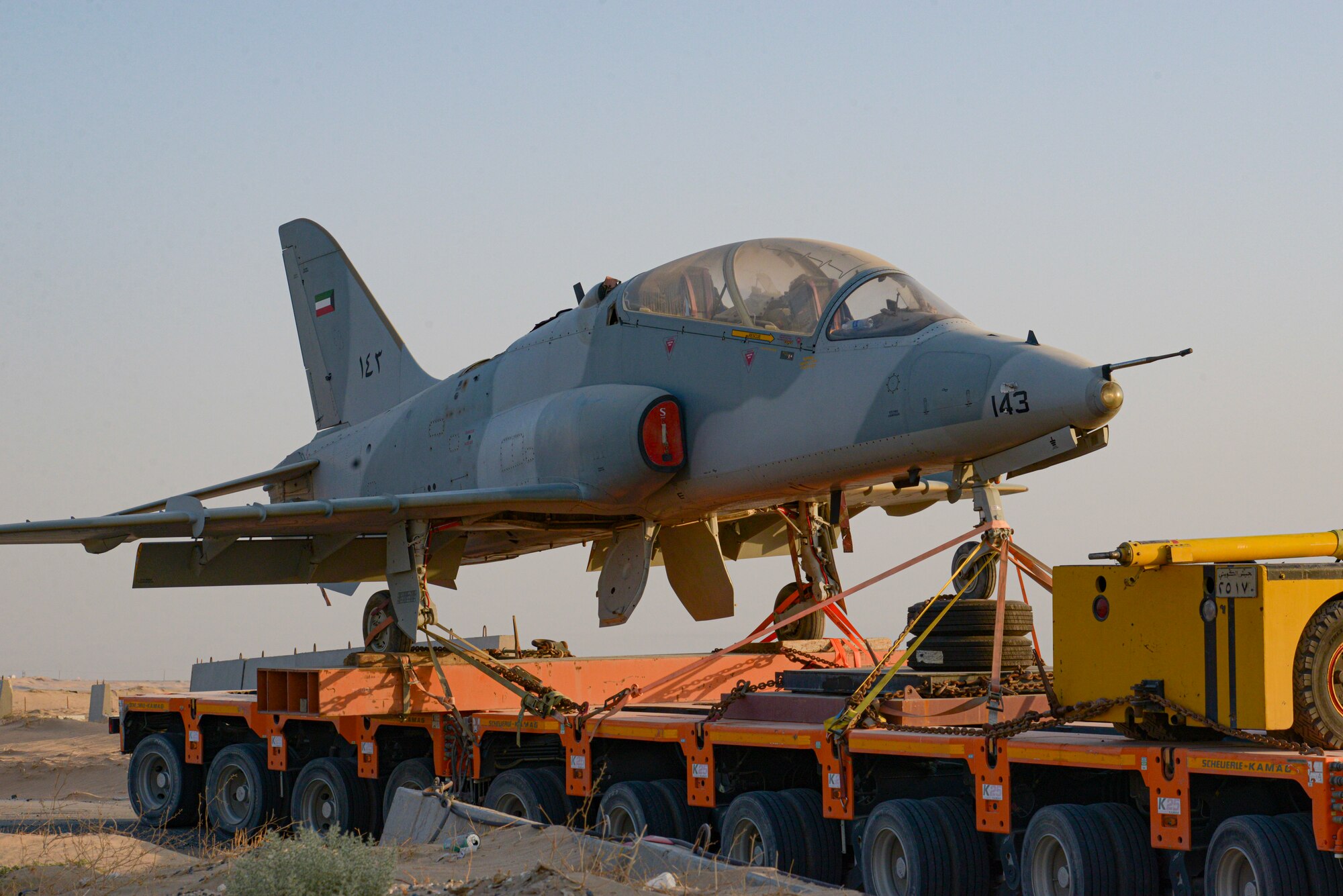 Multi-national forces transport a Kuwait Air Force Hawk Mk.64 aircraft from Al Mubarak Air Base, Kuwait to Ali Al Salem Air Base, Kuwait, Oct. 15, 2021.