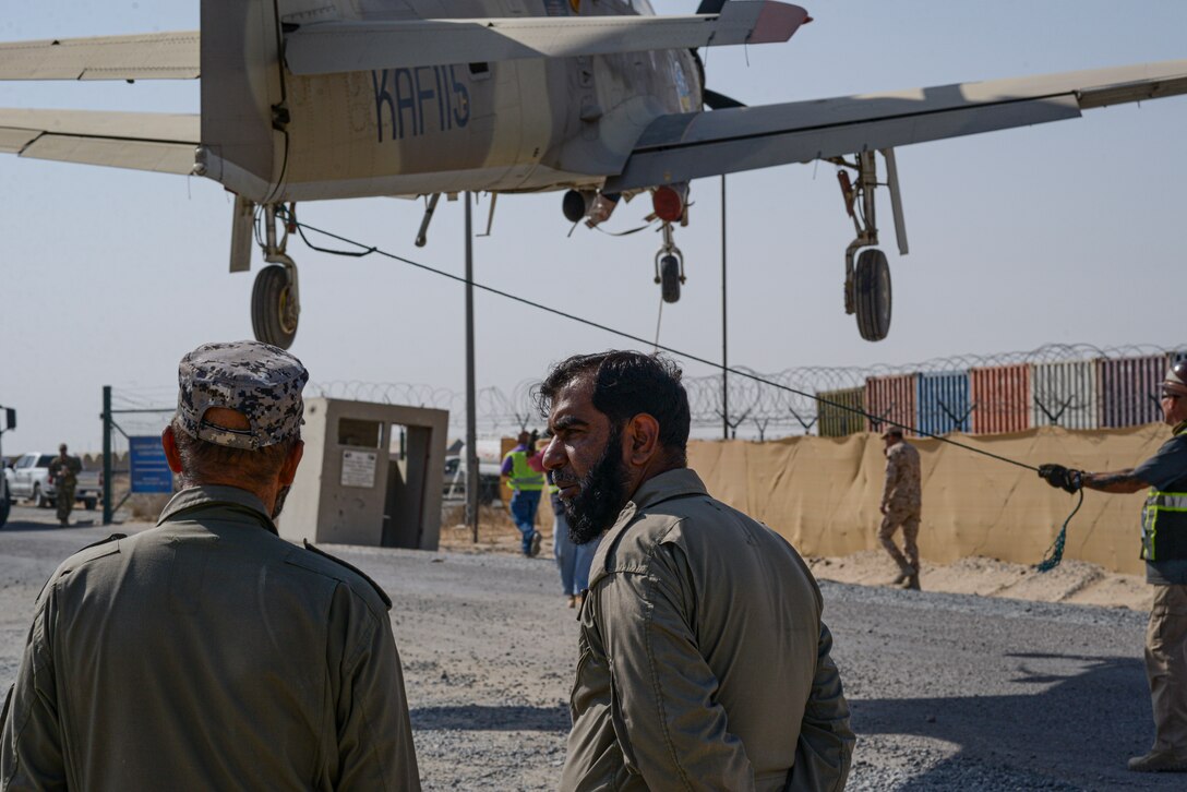 Kuwait Air Force maintainers watch as a joint ground movement of Kuwait Air Force aircrafts takes place between Al Mubarak Air Base and Ali Al Salem Air Base, Kuwait from Oct. 15, 2021.