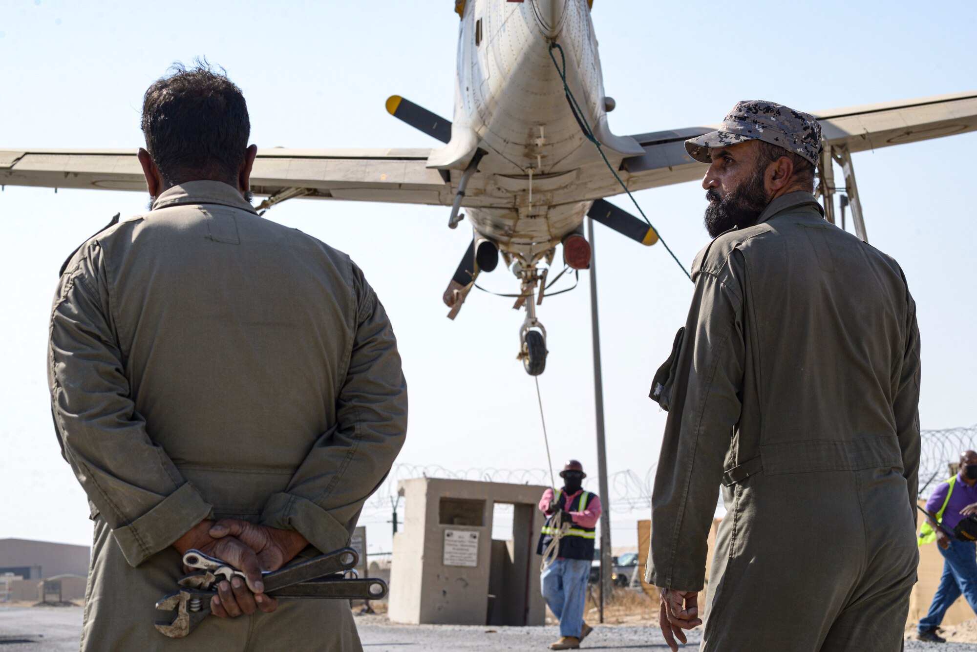 Kuwait Air Force maintainers watch as a joint ground movement of Kuwait Air Force aircrafts takes place between Al Mubarak Air Base and Ali Al Salem Air Base, Kuwait from Oct. 15, 2021.