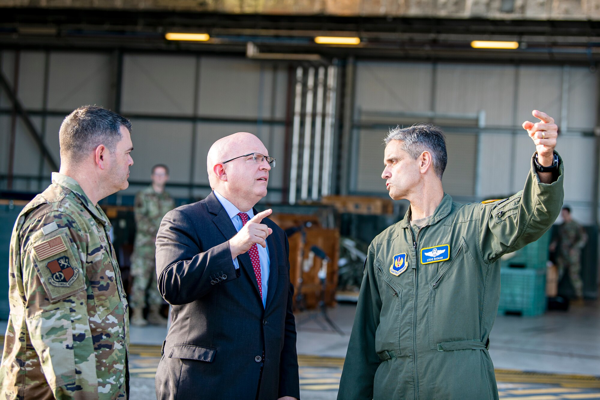 Ambassador Phillip T. Reeker, center, United States Embassy London Chargé d’Affaires, speaks with U.S. Air Force Lt. Gen. Steven L. Basham, right, U.S. Air Forces in Europe-Air Forces Africa deputy commander, at RAF Fairford, England, Oct. 20, 2021. Reeker and Basham visited RAFF to immerse with Airmen from the 9th Expeditionary Bomb Squadron who are temporarily stationed at Fairford for a BTF deployment. A BTF is the global employment of U.S. Strategic bombers, providing strategic military advantage to achieve national and combatant commander objectives. (U.S. Air Force photo by Senior Airman Eugene Oliver)