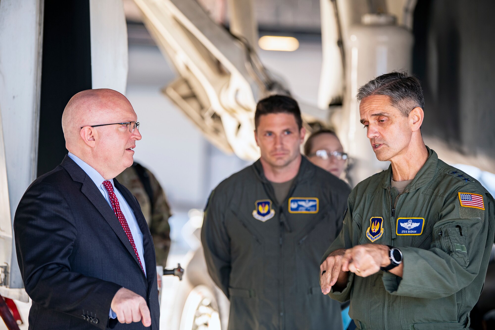 Ambassador Phillip T. Reeker, left, United States Embassy London Chargé d’Affaires, speaks with U.S. Air Force Lt. Gen. Steven L. Basham, right, U.S. Air Forces in Europe-Air Forces Africa deputy commander at RAF Fairford, England, Oct. 20, 2021. Reeker and Basham visited RAFF to immerse with Airmen from the 9th Expeditionary Bomb Squadron who are temporarily stationed at Fairford for a BTF deployment. A BTF is the global employment of U.S. strategic bombers,  which provide a  military advantage to achieve national and combatant commander objectives. (U.S. Air Force photo by Senior Airman Eugene Oliver)