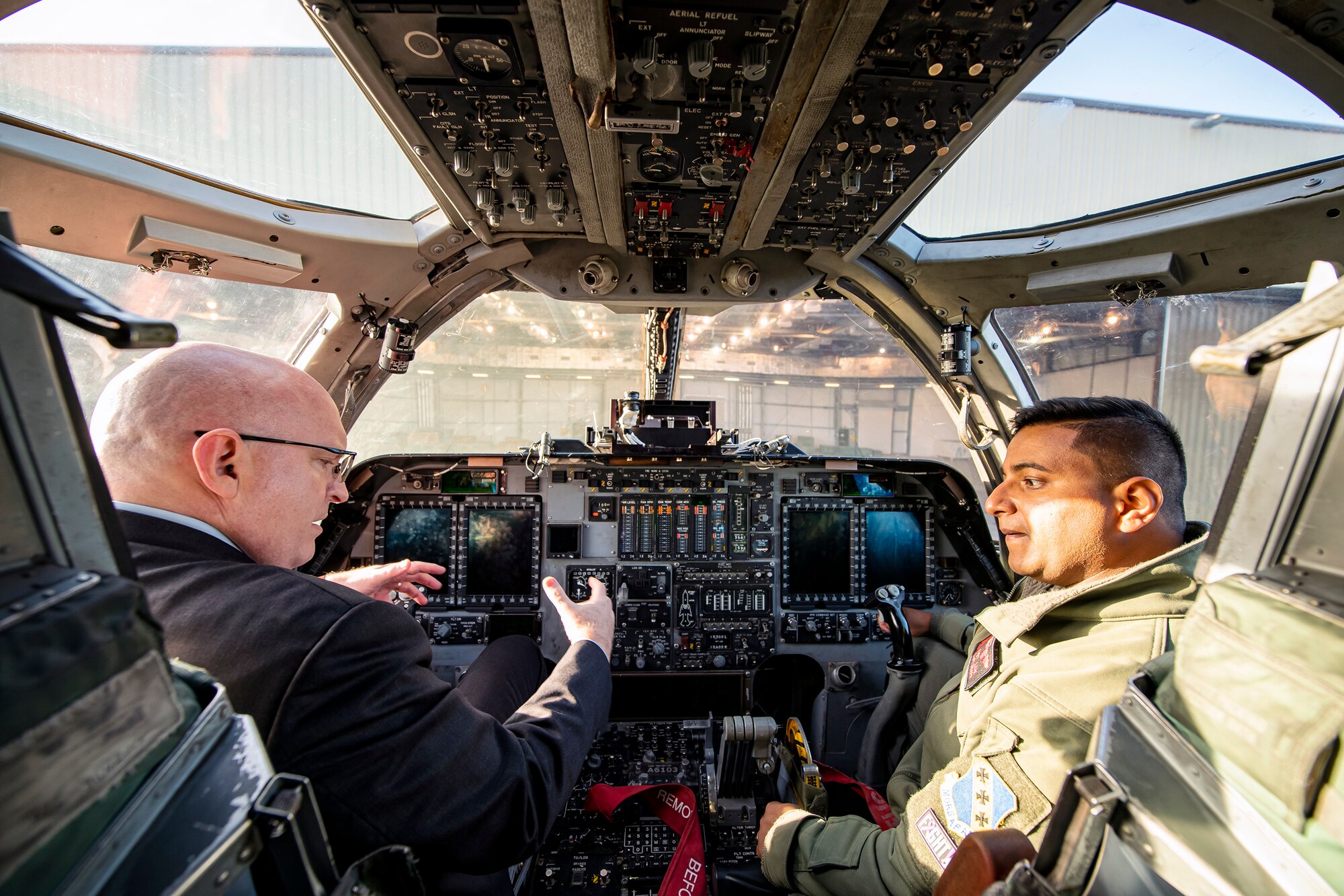 Ambassador Phillip T. Reeker, United States Embassy London Chargé d’Affaires, speaks with an Airman from the 9th Expeditionary Bomb Squadron inside the cockpit of a B-1B Lancer at RAF Fairford, England, Oct. 20, 2021.  Reeker visited RAF Fairford to immerse with Airmen from the 9th EBS who are temporarily stationed at Fairford for a BTF deployment. BTF deployments drive our allied and partnered coalition’s ability to continuously deliver airpower anywhere, anytime, and collectively build future operation capabilities in the defense of Europe as a whole. (U.S. Air Force photo by Senior Airman Eugene Oliver)