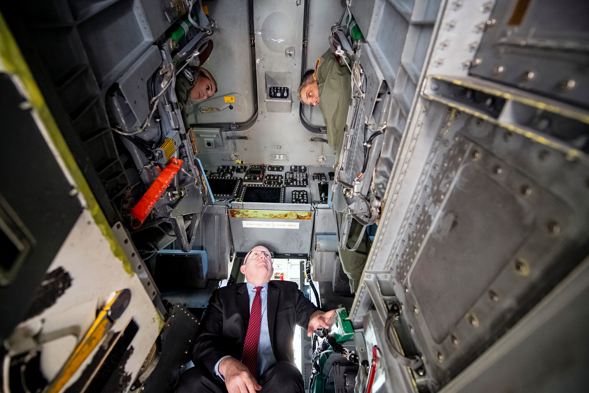 Ambassador Phillip T. Reeker, center, United States Embassy London Chargé d’Affaires, speaks with U.S. Air Force Lt. Gen. Steven L. Basham, right, U.S. Air Forces in Europe-Air Forces Africa deputy commander, inside of a B-1B Lancer at RAF Fairford, England, Oct. 20, 2021. Reeker and Basham visited RAF Fairford to immerse with Airmen from the 9th Expeditionary Bomb Squadron who are temporarily stationed at Fairford for a BTF deployment. A BTF is the global employment of U.S. Strategic bombers, providing strategic military advantage to achieve national and combatant commander objectives. (U.S. Air Force photo by Senior Airman Eugene Oliver)
