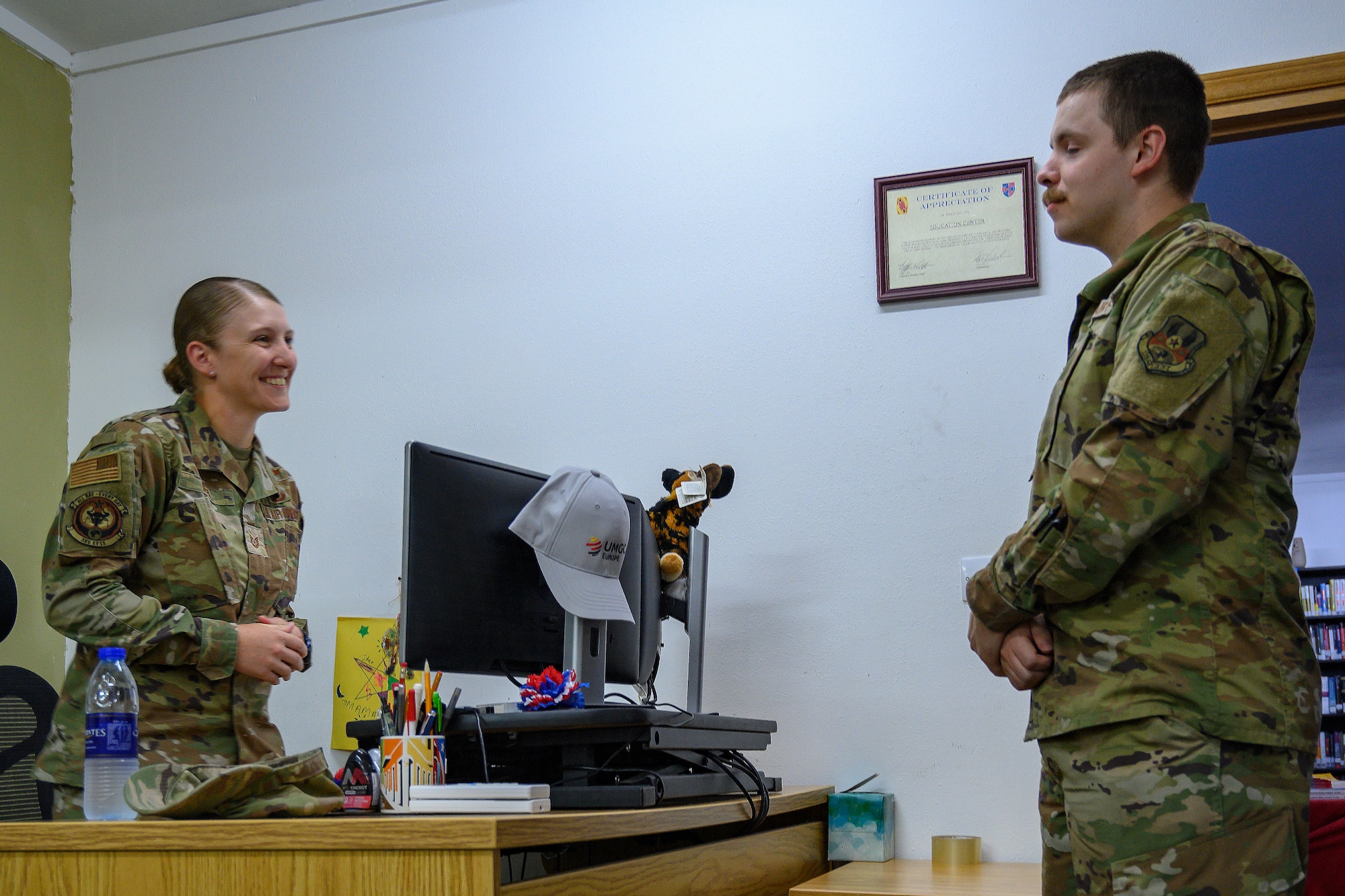 Airman provides educational counsel to another airman