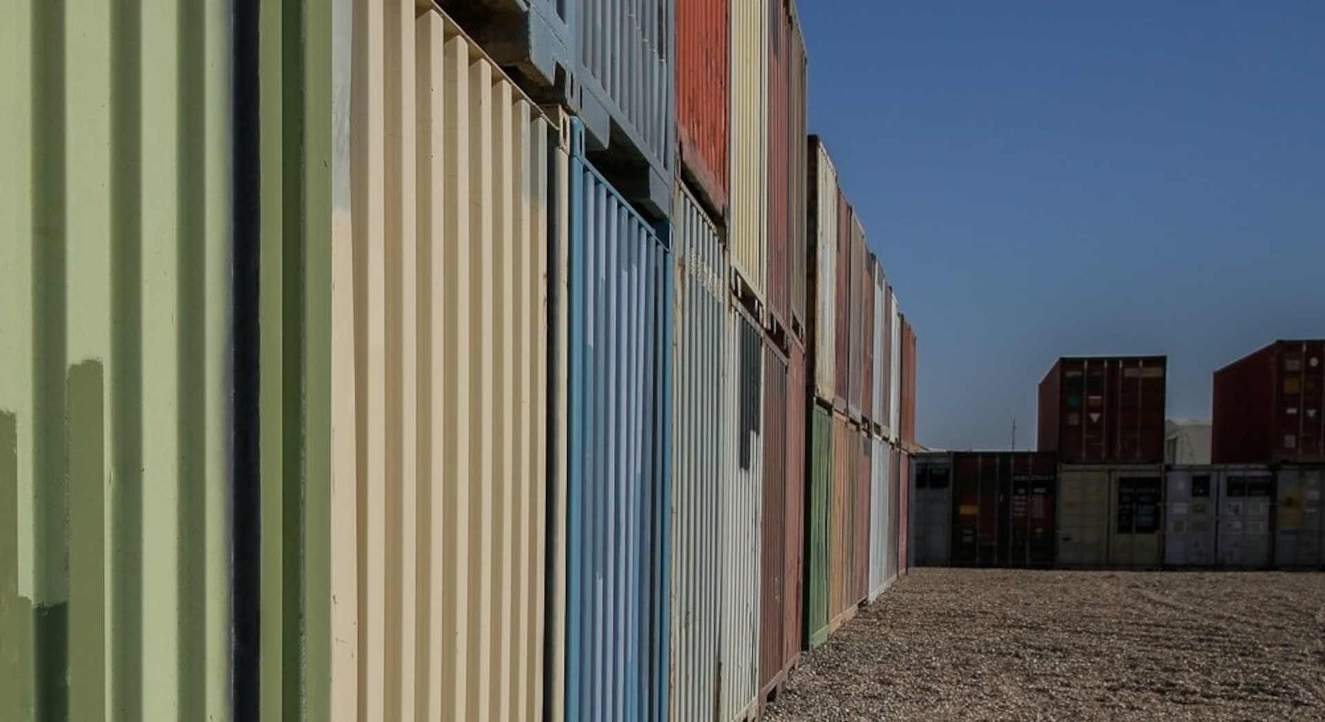 Dozens of containers of combat-related tactical equipment lie in wait to be transitioned out of theater at Al Asad Air Base on October 20, 2021. As equipment exits theater, Combined Joint Task Force-Operation Inherent Resolve remains ready and capable to deter threats while transitioning to an advise, assist and enable role in order to allow the continued defeat of Daesh. (U.S. Army photo by Spc. Clara Soria-Hernandez)