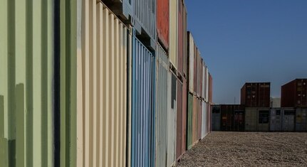Dozens of containers of combat-related tactical equipment lie in wait to be transitioned out of theater at Al Asad Air Base on October 20, 2021. As equipment exits theater, Combined Joint Task Force-Operation Inherent Resolve remains ready and capable to deter threats while transitioning to an advise, assist and enable role in order to allow the continued defeat of Daesh. (U.S. Army photo by Spc. Clara Soria-Hernandez)