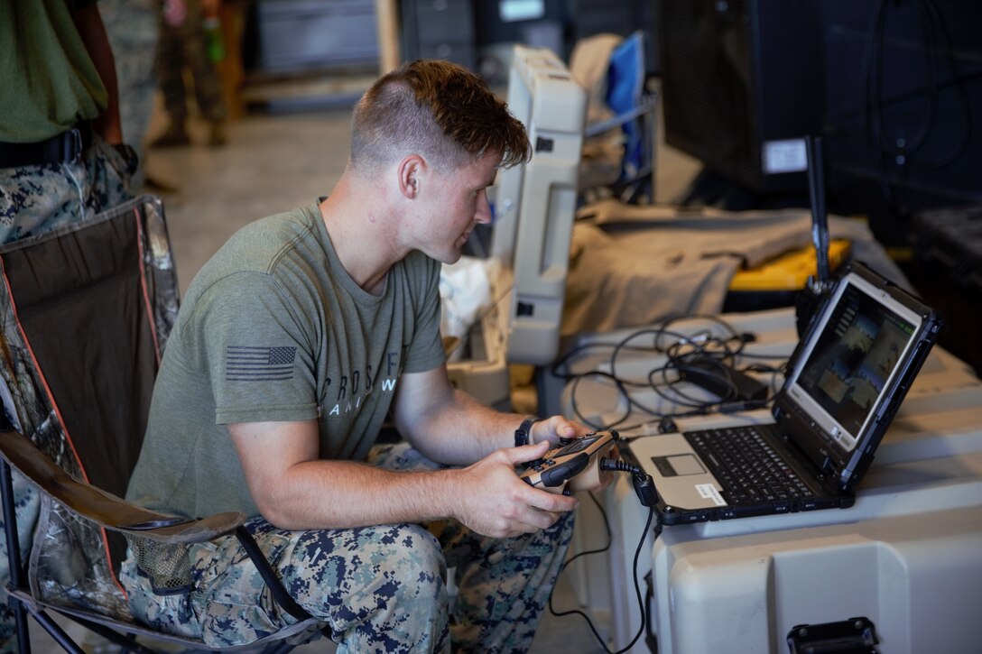 U.S. Marine Corps Sgt. Tyler Blattler, an explosive ordnance disposal technician with EOD Company, 8th Engineer Support Battalion, operates a Man Transportable Robotic System during the East Coast EOD Team of the Year Competition on Camp Lejeune, North Carolina, Oct. 22, 2021. 8th Engineer Support Battalion hosted the competition to evaluate and assess technical expertise around the joint EOD community.