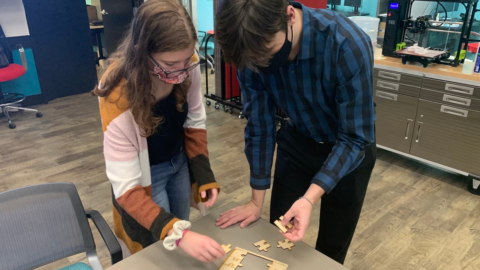 IMAGE: DAHLGREN, Va. (Oct. 22, 2021) – Micah Fitzgerald (left) and Dane Nielson, both students from Virginia Commonwealth University’s da Vinci Center, work together to put together a puzzle during a visit to NSWCDD’s Innovation Lab (iLab). The iLab empowers innovators to test ideas and solve naval warfare challenges. (U.S. Navy photo released)