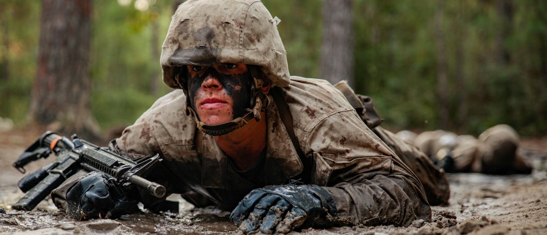A recruit with Papa Company, 4th Recruit Training Battalion, fireman carries his partner during the Crucible on Marine Corps Recruit Depot Parris Island, S.C. Oct. 22, 2021. During the 24 individual events of the Crucible, recruits are broken down into squads to face challenges that test their physical strength and teamwork skills they've developed throughout training. 



(U.S. Marine Corps photo by Sgt. Dana Beesley)