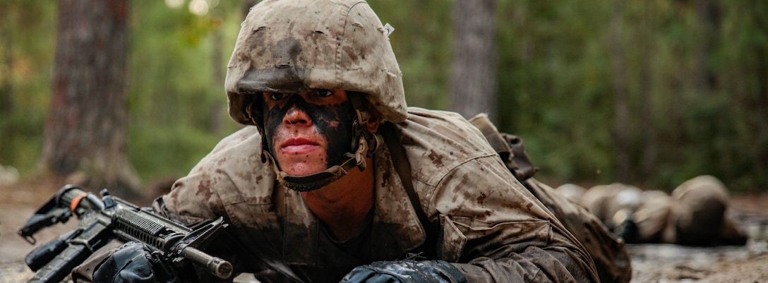 A recruit with Papa Company, 4th Recruit Training Battalion, low crawls through the mud during the Mariana Islands event of the Crucible on Marine Corps Recruit Depot Parris Island, S.C. Oct. 22, 2021. During the 24 individual events of the Crucible, recruits are broken down into squads to face challenges that test their physical strength and teamwork skills they've developed throughout training. 



(U.S. Marine Corps photo by Sgt. Dana Beesley)