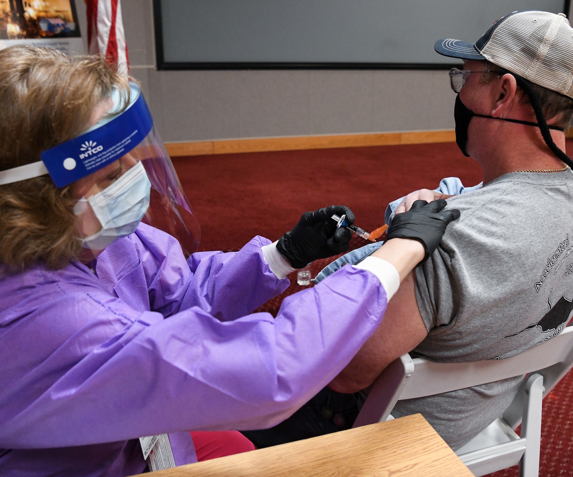 Tammie Litchford, a registered nurse with the Tullahoma office of the Coffee County Health Department, administers a flu vaccine to Charles Champion, a pipefitter at Arnold Air Force Base, Oct. 20, 2021, during a flu vaccine clinic held at Arnold AFB, Tenn. The clinic was conducted by the Coffee County Health Department with support from the Arnold AFB Medical Aid Station for individuals with access to the base. During the clinic, 141 individuals were vaccinated. (U.S. Air Force photo by Jill Pickett)