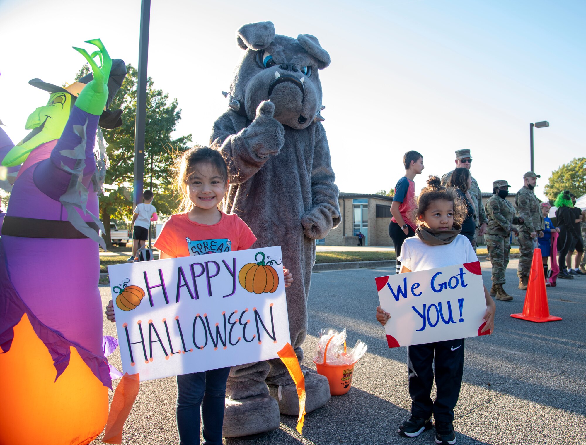 Team Dover children from the 436th Aerial Port Squadron greet families during the deployed families dinner and trunk or treat on Dover Air Force Base, Delaware, Oct. 21, 2021. Groups from across the 436th Airlift Wing host the quarterly event to give thanks to family members whose loved ones are deployed or on extended assignments. (U.S. Air Force photo by Tech. Sgt. Nicole Leidholm)