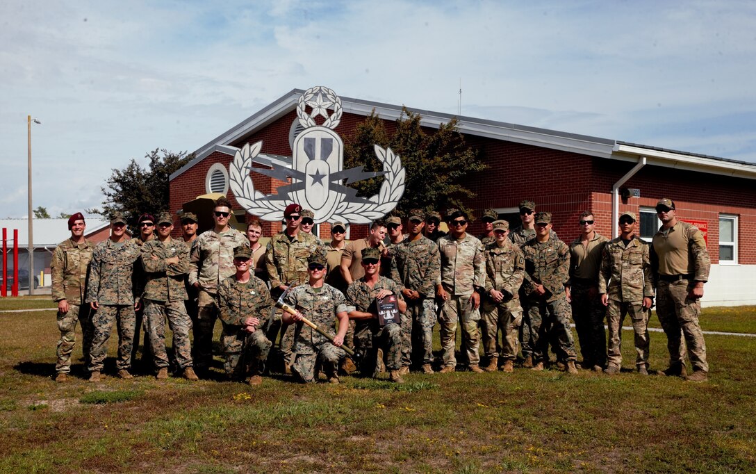 Members of the joint force pose for a photo during the East Coast EOD Team of the Year Competition on Camp Lejeune, North Carolina, Oct. 22, 2021. 8th Engineer Support Battalion hosted the competition to evaluate and assess technical expertise around the joint EOD community.