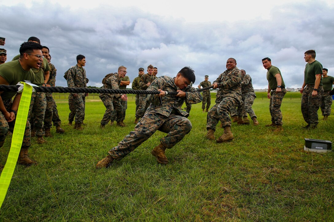 Marines compete during a tug of war challenge.