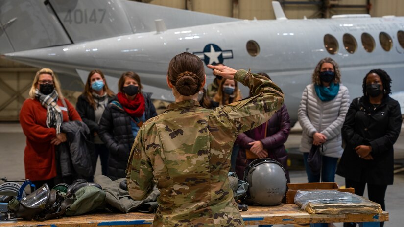 U.S. Air Force Senior Airman Lauren Whitman, 3rd Operations Support Squadron aircrew flight equipment technician, briefs 3rd Wing key spouses during an immersion at Joint Base Elmendorf-Richardson, Alaska, Oct. 14, 2021. The immersion gave key spouses an opportunity to see the 3rd Wing’s operations, educating and recognizing them as key components of the wing’s mission.  (U.S. Air Force photo by Senior Airman Justin Wynn)