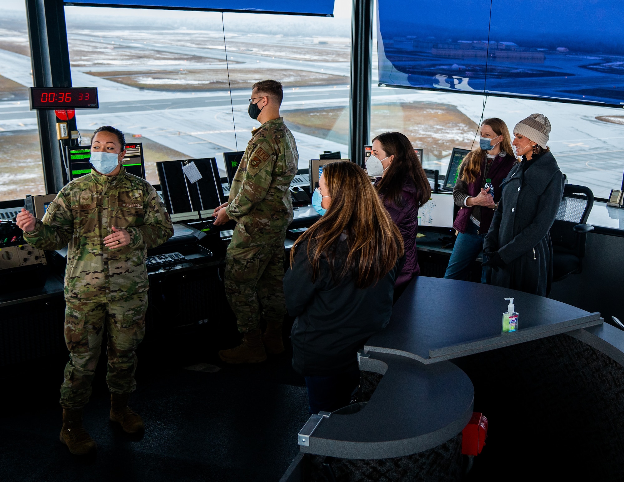 U.S. Air Force Senior Airman Fuatapu Hook, 3rd Operations Support Squadron air traffic controller, briefs 3rd Wing spouses during an immersion at Joint Base Elmendorf-Richardson, Alaska, Oct. 14, 2021. The immersion gave key spouses an opportunity to see the 3rd Wing’s operations, educating and recognizing them as key components of the wing’s mission.  (U.S. Air Force photo by Senior Airman Justin Wynn)